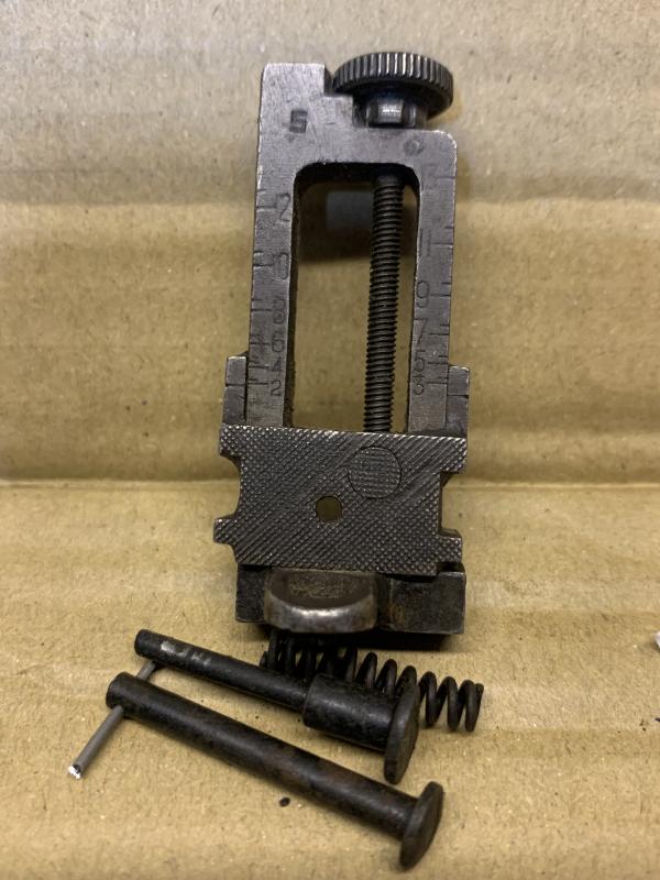 LEE ENFIELD No4 MK1 SINGER TYPE MILLED REAR SIGHT. GOOD WORKING ORDER WITH GOOD CLICKS . SCARCE SAVAGE MARKED. HAS NO OTHER MARKINGS.